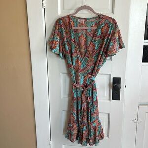 Cienna super cute wrapped dress very flattering fluttery sleeves. Very feminine.
